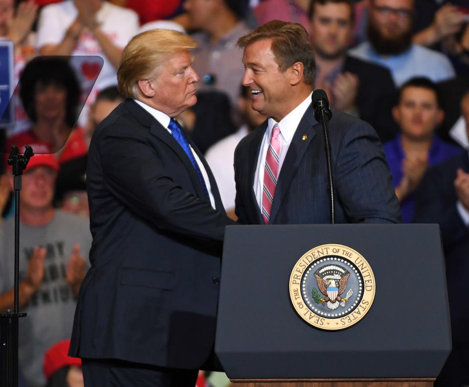 President Trump talks with Sen. Dean Heller, R-Nev., during a campaign rally at the Las Vegas Convention Center on Sept. 20, 2018. (Photo: Ethan Miller/Getty Images)