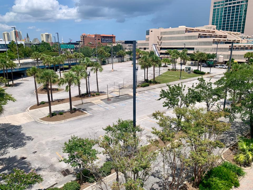 Cross Regions Group wants to build a condominium tower on city-owned land used now as a parking lot east of the Main Street bridge. Redevelopment of the parcel would require demolishing an off-ramp from the Main Street bridge that runs along the back portion of the property. The Daniel Building that's part of the Hyatt Regency Jacksonville Riverfront is at right.