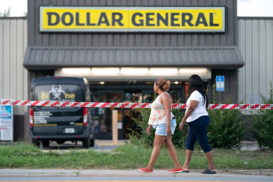People walk past the Dollar General store where three people were shot and killed the day before on August 27, 2023 in Jacksonville, Florida. (Photo by Sean Rayford/Getty Images)
