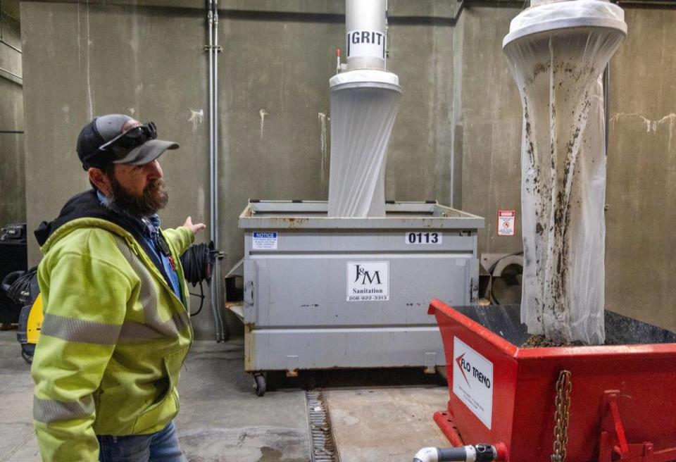 Wastewater supervisor Travis Fleming shows Statesman reporters one of the stages of water treatment, the initial removal of solid, indigestible waste.