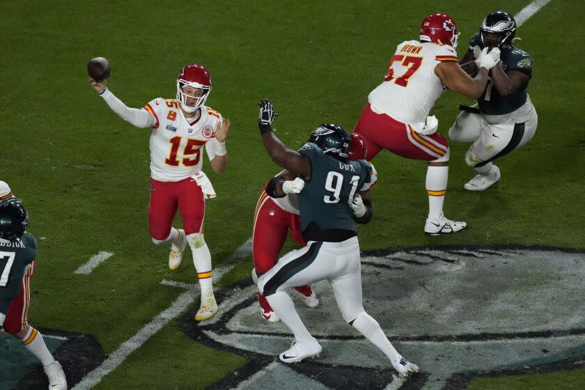 Kansas City Chiefs quarterback Patrick Mahomes (15) throws against the Philadelphia Eagles during the second half of the NFL Super Bowl 57 football game, Sunday, Feb. 12, 2023, in Glendale, Ariz. (AP Photo/Charlie Riedel)