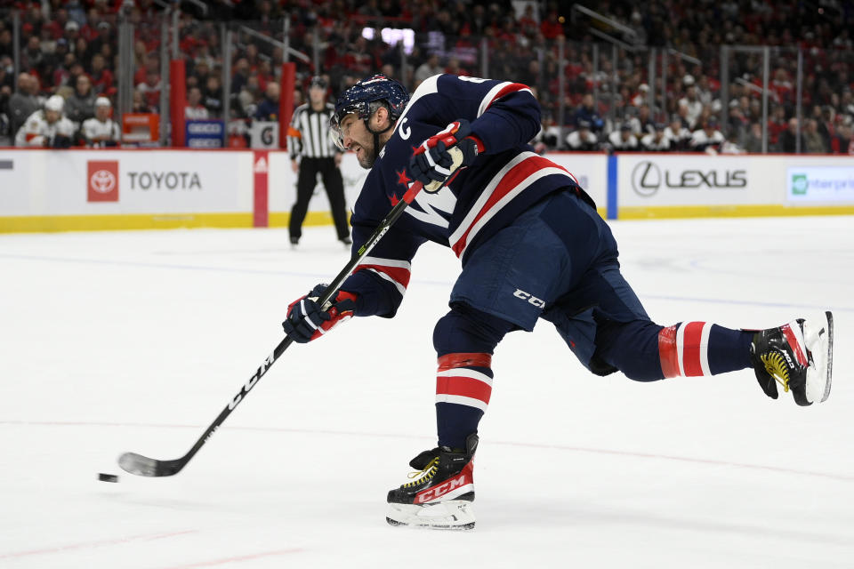 Washington Capitals left wing Alex Ovechkin (8) takes a shot during the first period of an NHL hockey game against the Florida Panthers, Friday, Nov. 26, 2021, in Washington. (AP Photo/Nick Wass)