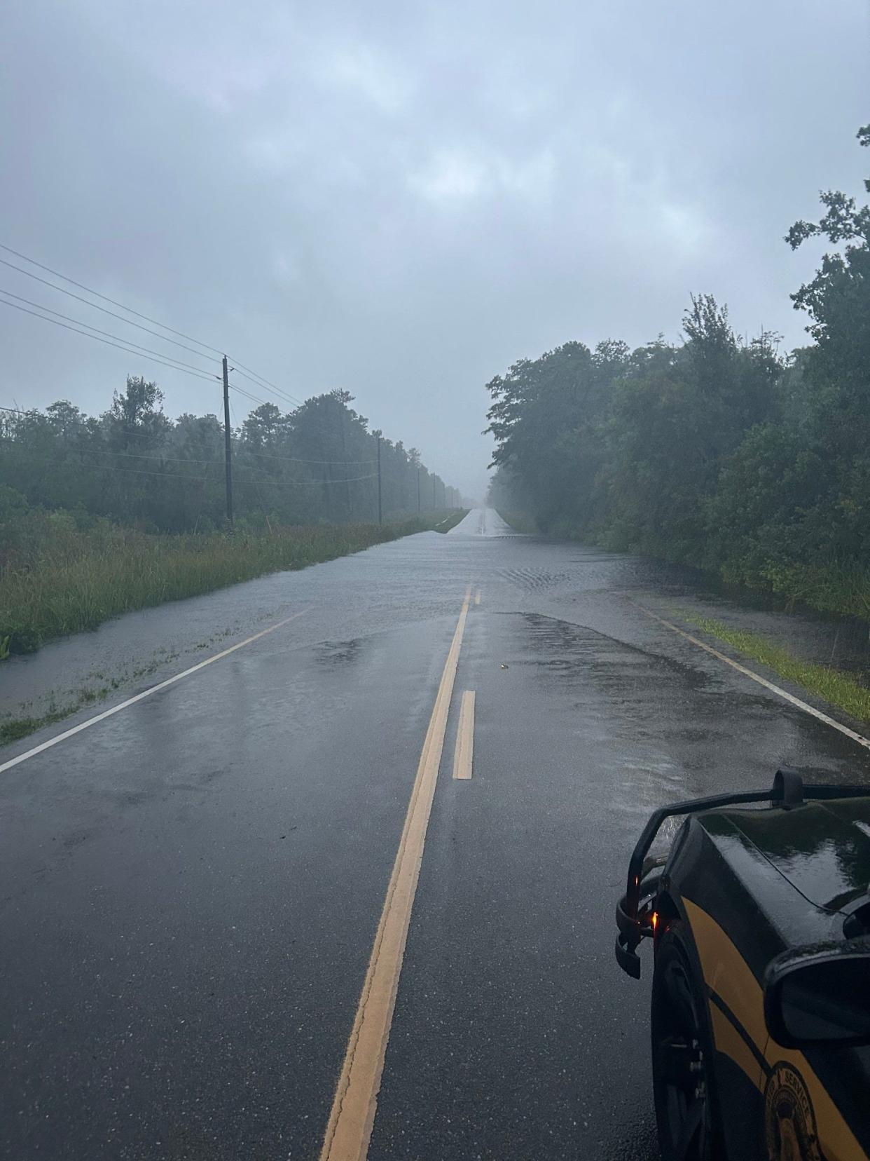 A section of N.C. 133 near Funston Road sits under water during Tropical Storm Debby on August 7, 2024. According to NCDOT representatives, this section of roadway sees two to three feet of water during major storm events. It is scheduled for improvements this fall.