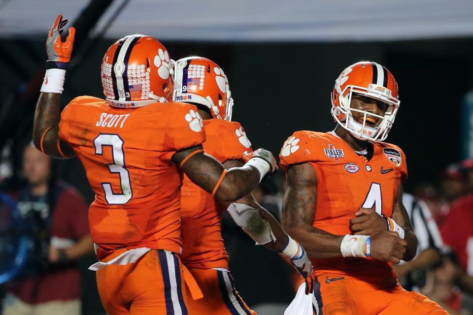 Artavis Scott, Wayne Gallman (M) and Deshaun Watson are all likely going pro. (Getty)