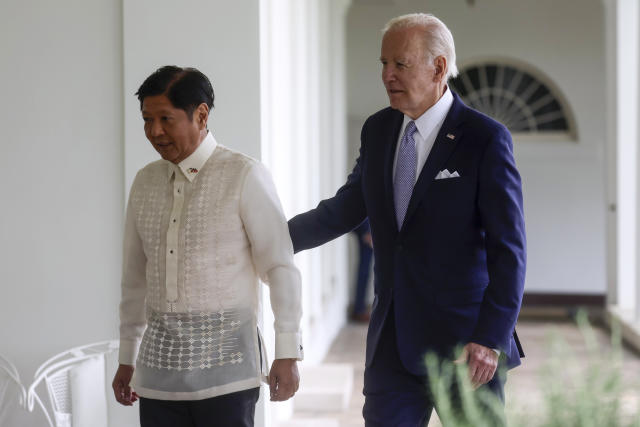 President Joe Biden and Philippines President Ferdinand Marcos Jr. walk on the West Colonnade to the Oval Office following a welcome ceremony at the White House in Washington, Monday, May 1, 2023. (Leah Millis/Pool via AP)
