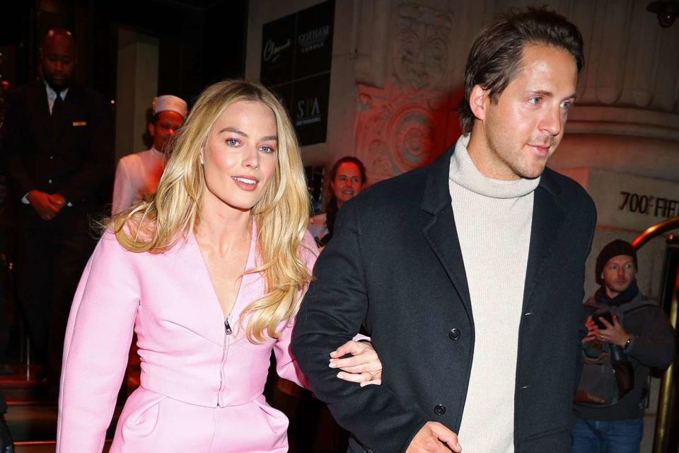 <p>Backgrid</p> Margot Robbie and husband Tom Ackerley pictured leaving the Peninsula Hotel on Nov. 28, 2023