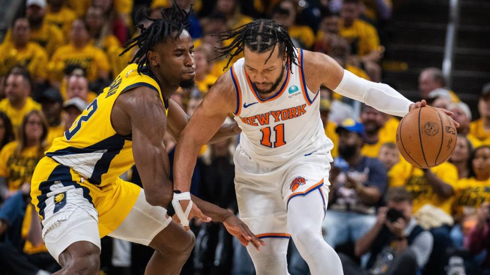 May 10, 2024; Indianapolis, Indiana, USA; New York Knicks guard Jalen Brunson (11) dribbles the ball while Indiana Pacers forward Aaron Nesmith (23) defends during game three of the second round for the 2024 NBA playoffs at Gainbridge Fieldhouse.