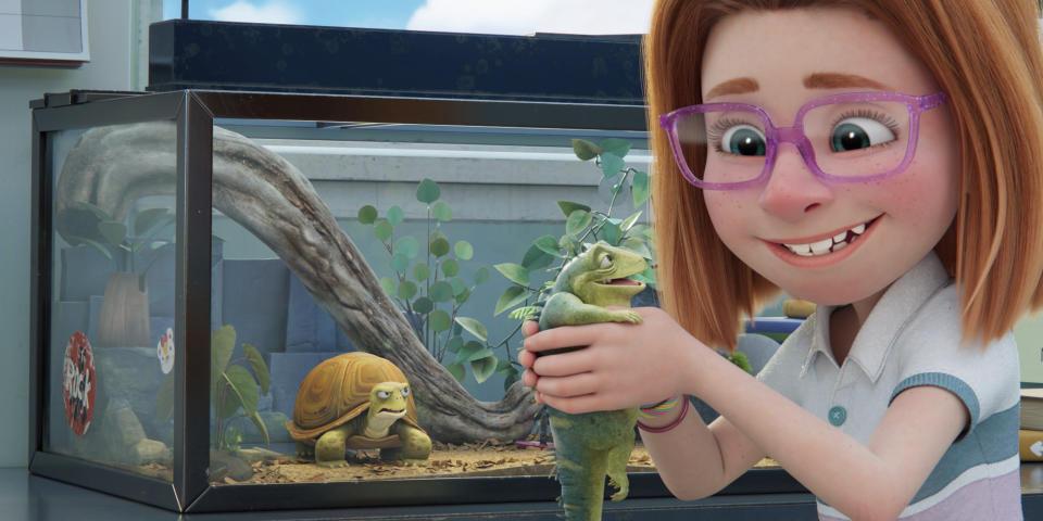 This image released by Netflix shows Leo, a 74-year-old lizard voiced by Adam Sandler, center, being held by Summer, voiced by Sunny Sandler, as Squirtle the turtle, voiced by Bill Burr, looks on at left, in a scene from "Leo." (Netflix via AP)
