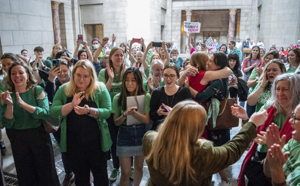 Cheers erupt in the Rotunda after a bill that would have banned abortions in Nebraska after about six weeks failed to get the votes necessary to invoke cloture, Thursday, April 27, 2023, at the Nebraska State Capital in Lincoln, Neb. (Larry Robinson/Lincoln Journal Star via AP)
