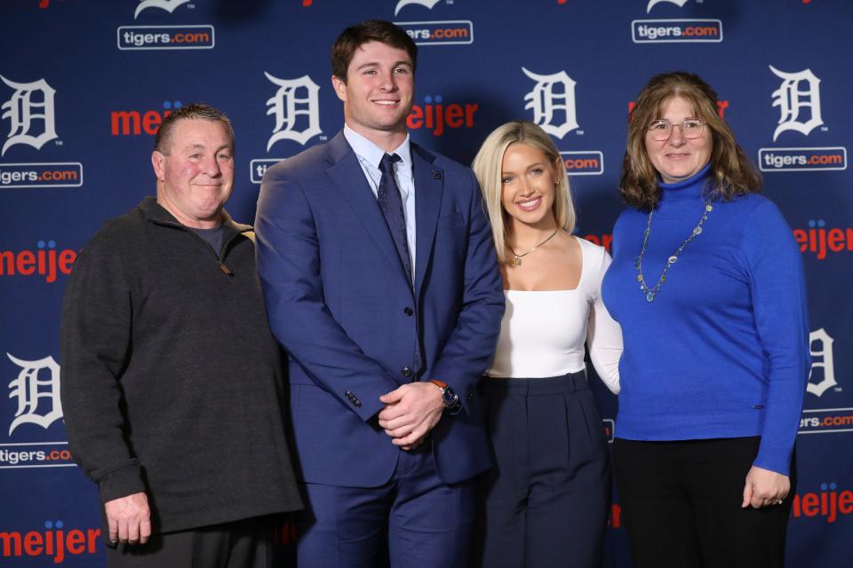 Detroit Tigers’ Colt Keith (2nd from left) poses with his father Troy Keith, his fiancé Kait Vickers, and his mother Mary Keith, during a press conference at Comerica Park in Detroit on Jan. 30, 2024.