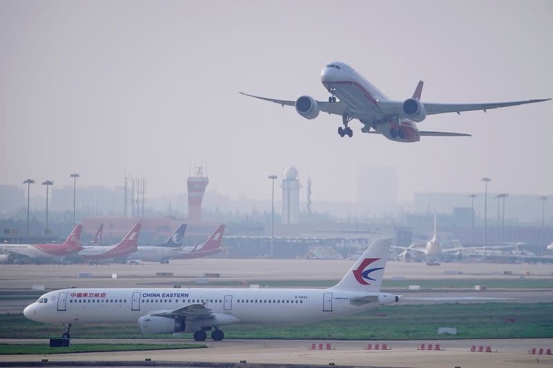 FILE PHOTO: A China Eastern Airlines aircraft and Shanghai Airlines aircraft are seen in Hongqiao International Airport in Shanghai