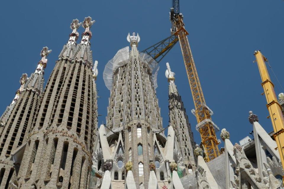 Sagrada Familia with crane and construction equipment around it