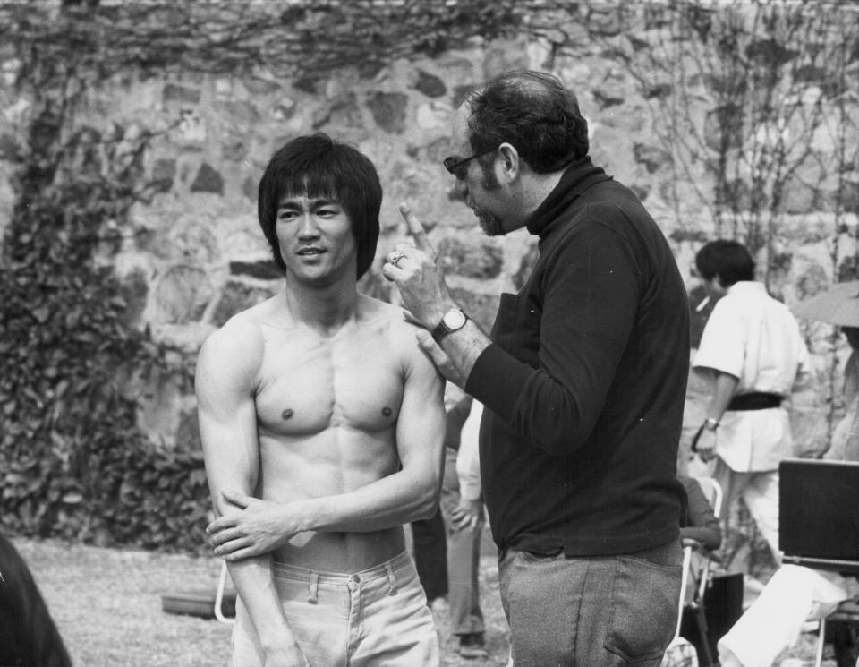 Actor Bruce Lee with producer Fred Weintraub, on the set of the movie 'Enter the Dragon', 1973. (Photo by Stanley Bielecki Movie Collection/Getty Images)