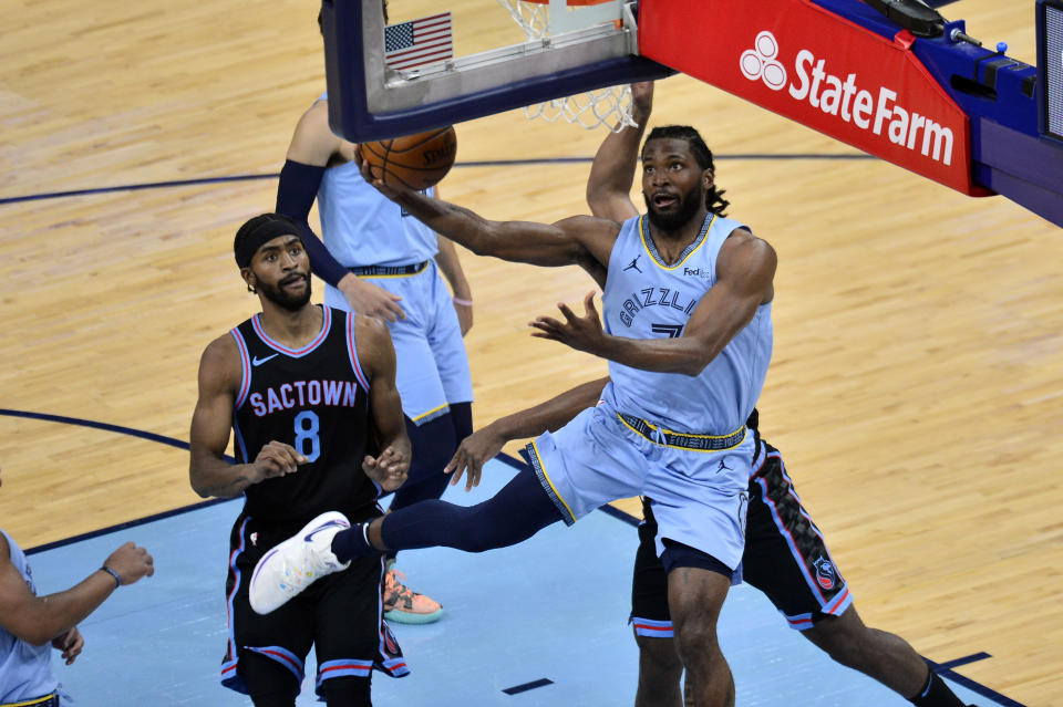 Memphis Grizzlies forward Justise Winslow (7) shoots the ball ahead of Sacramento Kings forward Maurice Harkless (8) in the first half of an NBA basketball game Friday, May 14, 2021, in Memphis, Tenn. (AP Photo/Brandon Dill)