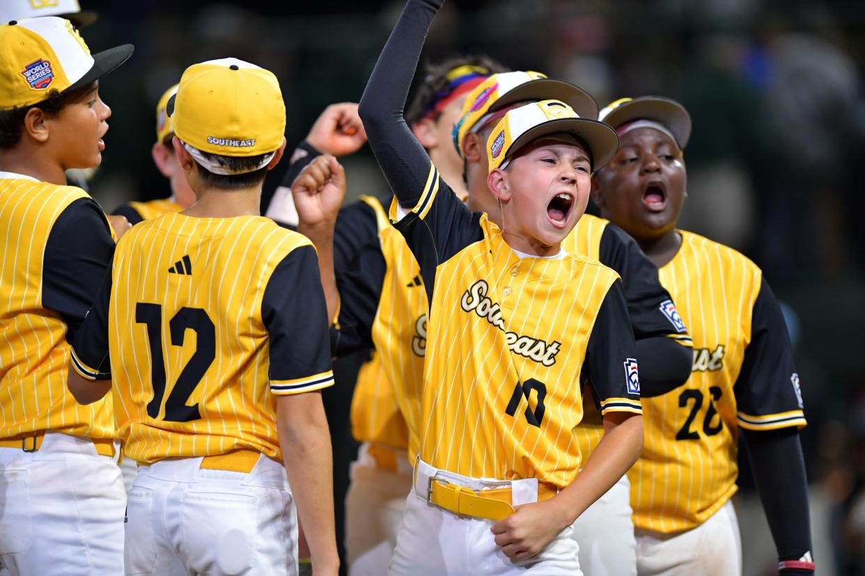 Southeast Region infielder Hunter Alexander (10) reacts with teammates after the game against West Region at Lamade Stadium.