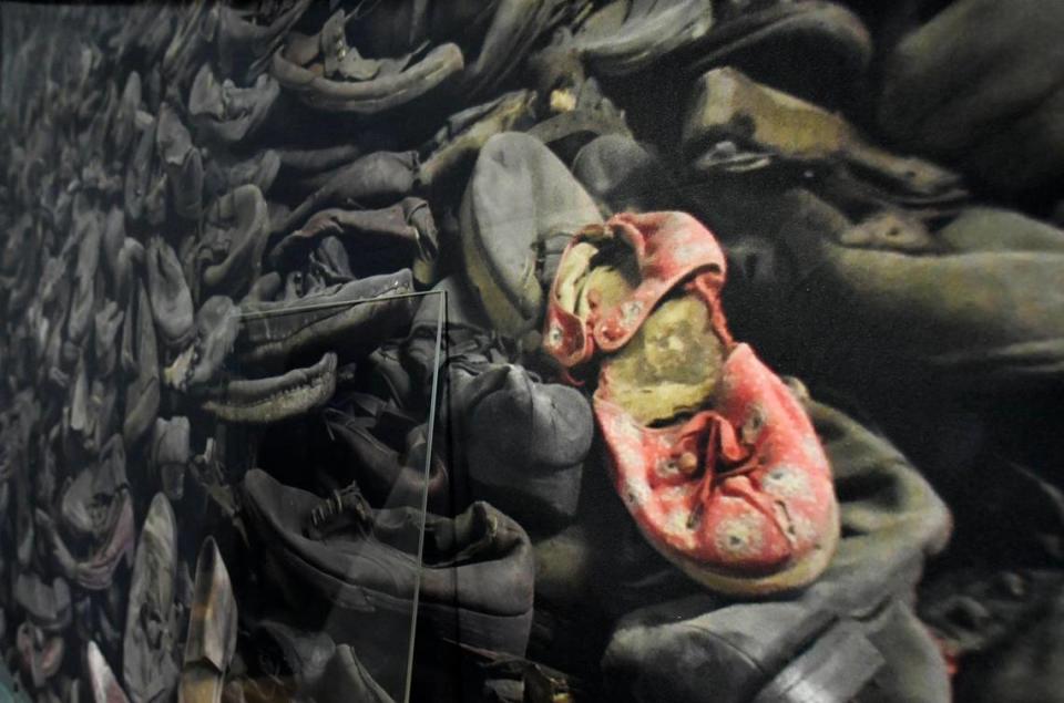 A photograph showing discarded shoes from a Nazi concentration camp is part of “Auschwitz. Not Long Ago. Not Far Away.” The exhibition features more than 700 original artifacts and 400 photographs.