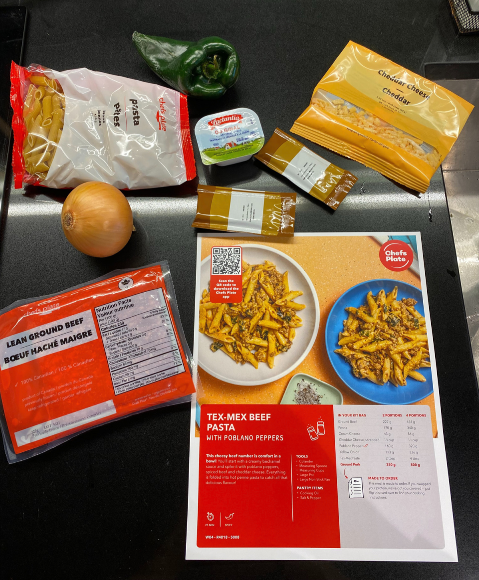 Chefs Plate's Tex-Mex Beef Pasta recipe on counter with onion, ground beef, cheddar cheese, pepper