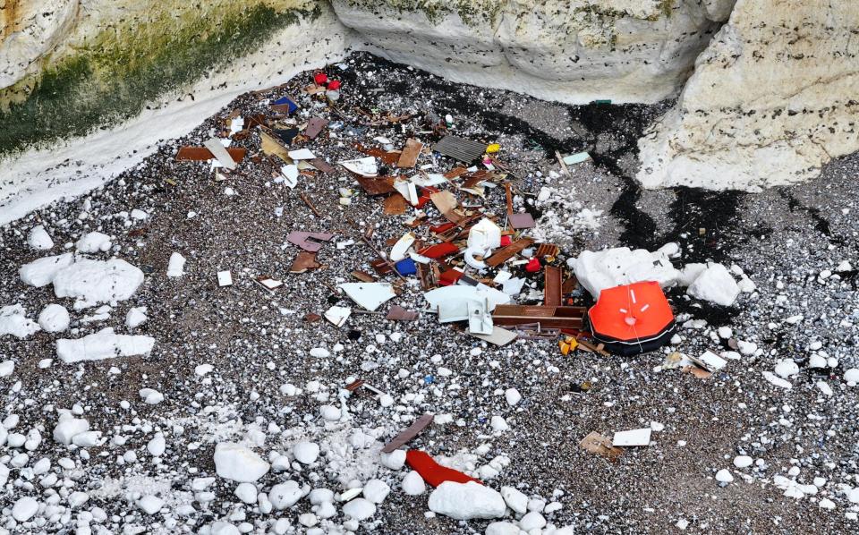 Debris from the boat scattered across the shore