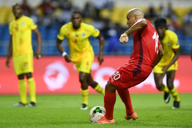 Tunisia's midfielder Wahbi Khazri takes a penalty kick to score his team's fourth goal against Zimbabwe on January 23, 2017