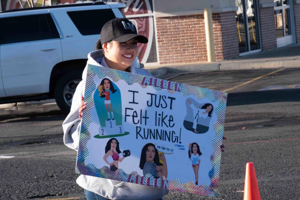 A supporter holds up a sign Saturday at the Cold As Ice run in Amarillo.