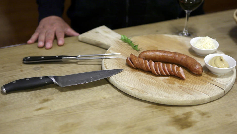 In this photo taken Thursday, April 19, 2012, a served pair of "Kranjska" sausages are pictured in a restaurant in Ljubljana, Slovenia. Slovenia and Austria are gearing up for a diplomatic battle over a delicacy both countries claim their own, a spicy pork sausage. (AP Photo/Darko Bandic)