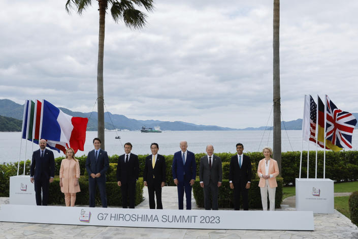 From left, President of the European Council Charles Michel, Italy's Prime Minister Giorgia Meloni, Canada's Prime Minister Justin Trudeau, France's President Emmanuel Macron, Japan's Prime Minister Fumio Kishida, U.S. President Joe Biden, Germany's Chancellor Olaf Scholz, Britain's Prime Minister Rishi Sunak and European Commission President Ursula von der Leyen participate in a family photo with G7 leaders before their working lunch meeting on economic security during the G7 summit, at the Grand Prince Hotel in Hiroshima, western Japan Saturday, May 20, 2023. (Jonathan Ernst/Pool Photo via AP)