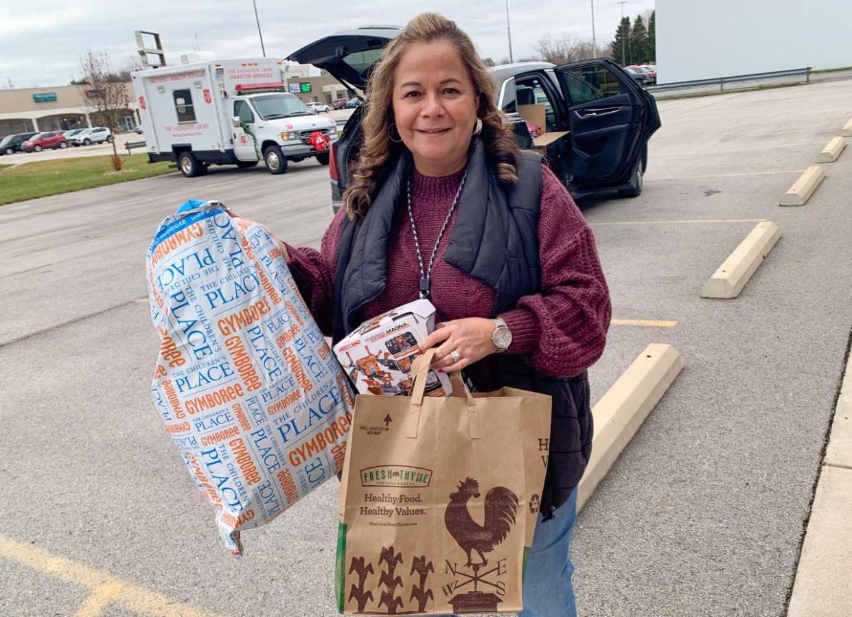 Patty Bahnsen, an Advanced Nuclear Specialist, delivers toys collected by Davis-Besse Nuclear Power Station employees to the Ottawa County Salvation Army Service Center.