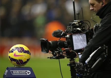 A television camera films the match ball before Liverpool's English Premier League soccer match against Tottenham Hotspur at Anfield in Liverpool, northern England, February 10, 2015. REUTERS/Phil Noble