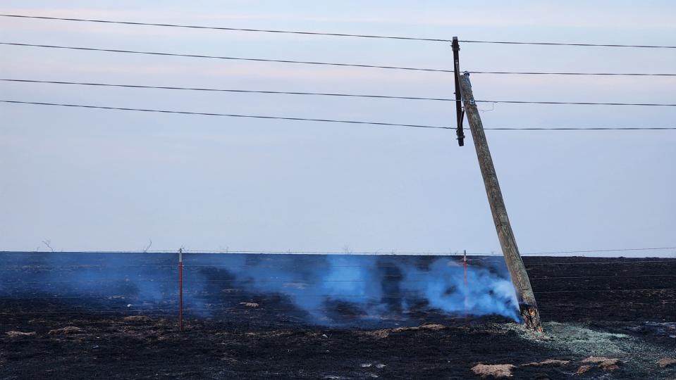 A power line near Canadian is seen still burning from the Smokehouse Creek Fire in late February in Hemphill County.