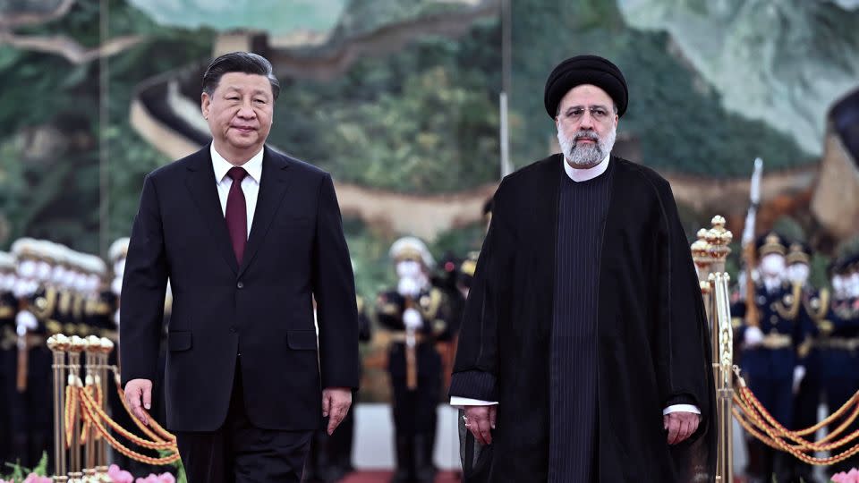 Chinese leader Xi Jinping and Iranian President Ebrahim Raisi review an honor guard during a welcome ceremony in Beijing on February 14, 2023. - Yan Yan/AP