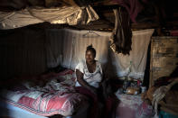 Pretty Mkhabela, a HIV-positive sex worker, sits inside her house in Ngodwana, South Africa, Friday, July 3, 2020. She gets her antiretroviral drugs delivered to her house by as part of a campaign to make sure that the treatment of South Africa's HIV positive population is maintained during the COVID-19 pandemic. Across Africa and around the world, the COVID-19 pandemic has disrupted the supply of antiretroviral drugs to many of the more than 24 million people who take them, endangering their lives. An estimated 7.7 million people in South Africa are HIV positive, the largest number in the world, and 62% of them take the antiretroviral drugs that suppress the virus and prevent transmission. (AP Photo/Bram Janssen)