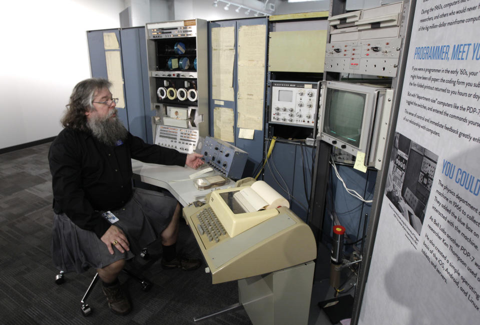 In this photo taken Oct. 30, 2012, Ian King, senior vintage systems engineer at the Living Computer Museum in Seattle, sits at the controls of a DEC PDP-7 computer from the mid 1960s, one of the oldest running computers at Paul Allen's newly opened Living Computer Museum, which features working models of old computers. (AP Photo/Ted S. Warren)