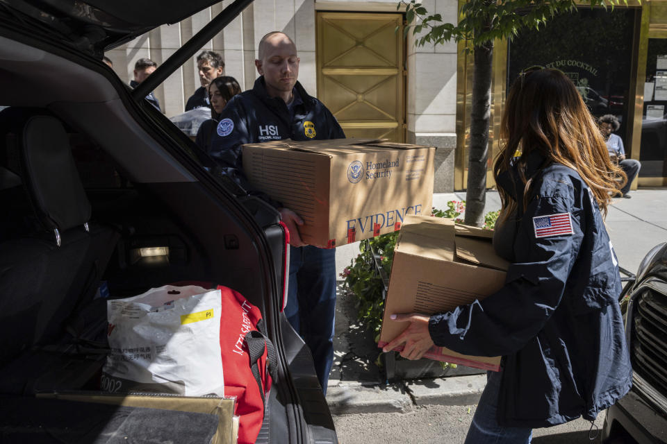 Federal agents put evidence boxes into a car outside a Park Avenue high-rise on Thursday, Sep. 1, 2022, in New York. FBI agents and Homeland Security Investigations personnel searched properties linked to Viktor Vekselberg, a close ally of Russian President Vladimir Putin. U.S. federal agents on Thursday simultaneously searched properties in Manhattan, the posh beach community of Southampton, N.Y., and on an exclusive Miami island that have been linked to the billionaire Russian oligarch whose $120 million yacht was seized in April. (AP Photo/Yuki Iwamura)