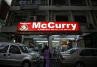 Customers arrive at McCurry Restaurant in Kuala Lumpur, Malaysia September 4, 2009. REUTERS/Bazuki Muhammad
