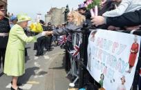 Britain's Queen Elizabeth walks through Windsor on her 90th Birthday, in Windsor, Britain April 21, 2016. REUTERS/John Stillwell/Pool