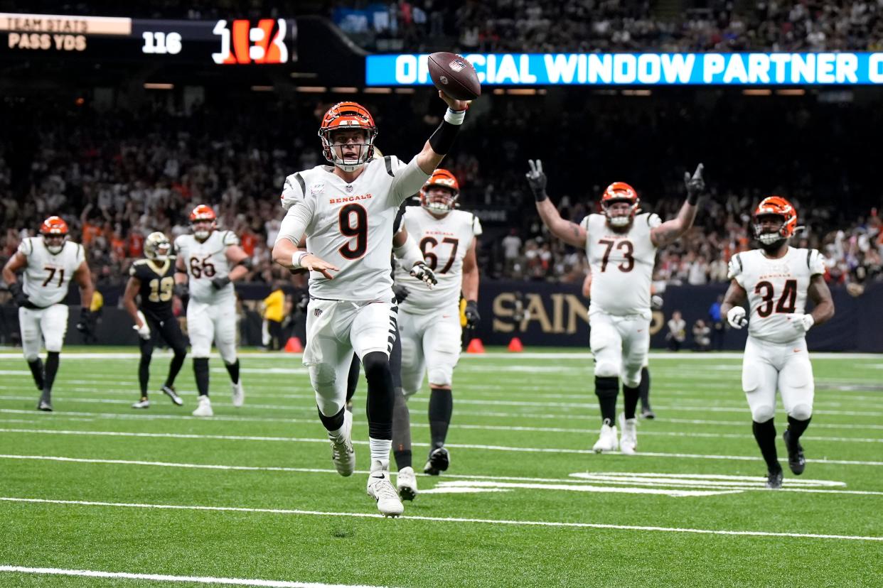 Cincinnati Bengals quarterback Joe Burrow (9) runs for a touchdown in the second quarter during an NFL Week 6 game against the New Orleans Saints, Sunday, Oct. 16, 2022, at Mercedes-Benz Superdome in New Orleans.