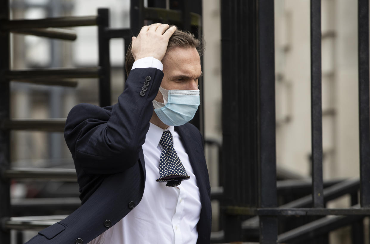 Television presenter Dr Christian Jessen leaves Belfast High Court as defamation proceedings taken against him by First Minister Arlene Foster continue. Picture date: Friday May 21, 2021.