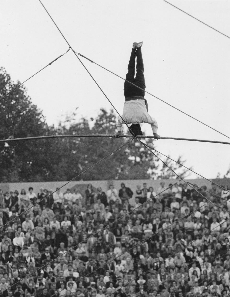 Karl Wallenda performs a headstand halfway across the high wire at the Akron Rubber Bowl on Sept. 15, 1973.