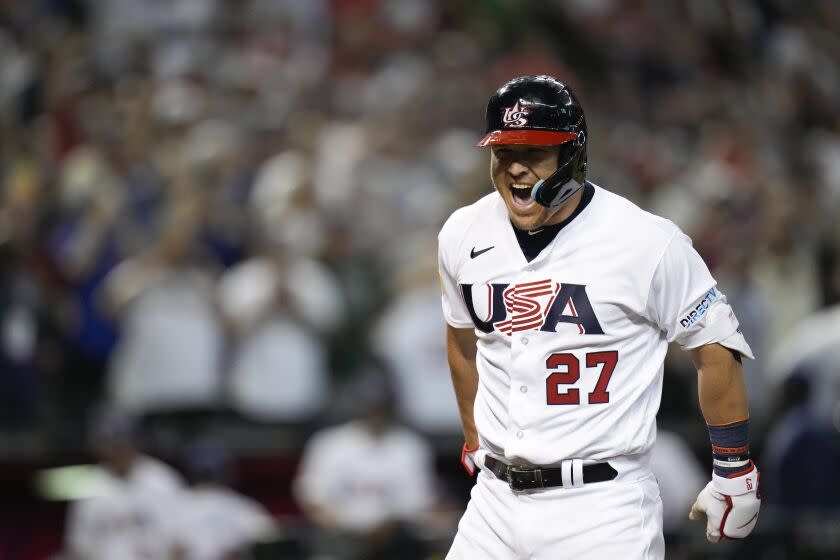 United States' Mike Trout celebrates his three-run home run against Canada during the first inning.