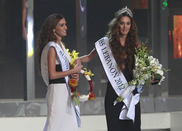 Miss Lebanon 2012 Rina Shibany and her twin sister and runner-up. AFP