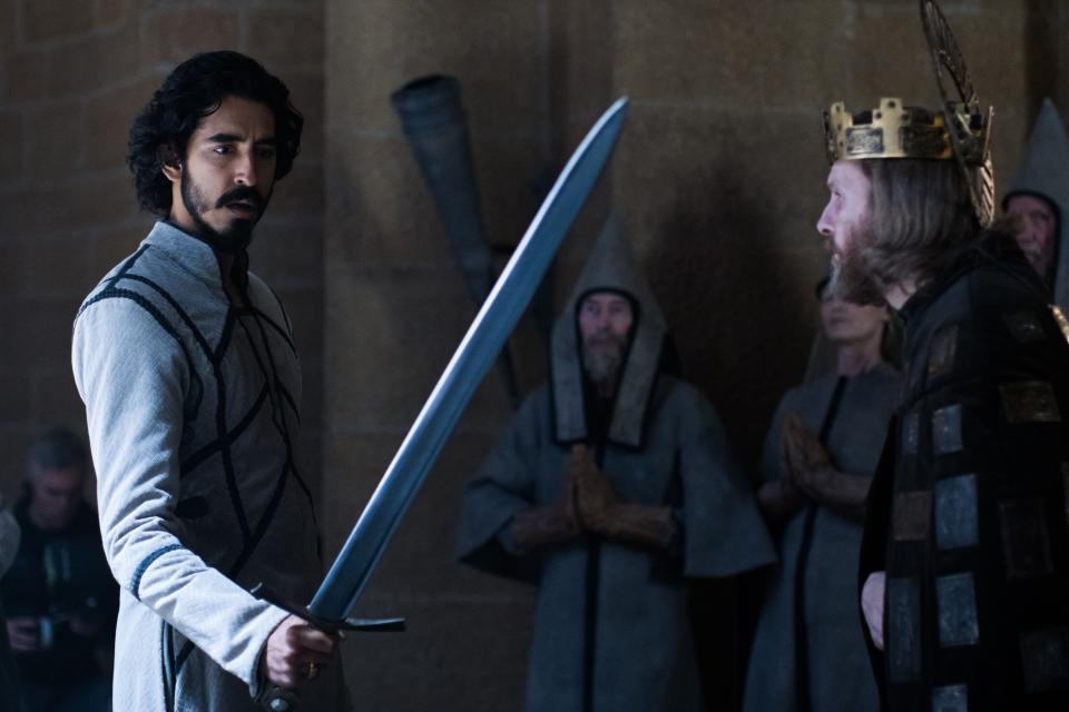 Gawain (Dev Patel, left) is lent King Arthur's (Sean Harris) sword, Excalibur, as he goes up against the Green Knight.