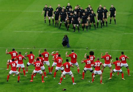 Rugby Union - New Zealand v Tonga - IRB Rugby World Cup 2015 Pool C - St James' Park, Newcastle, England - 9/10/15 Tonga perform the Sipi Tau as New Zealand look on before the game Action Images via Reuters / Lee Smith