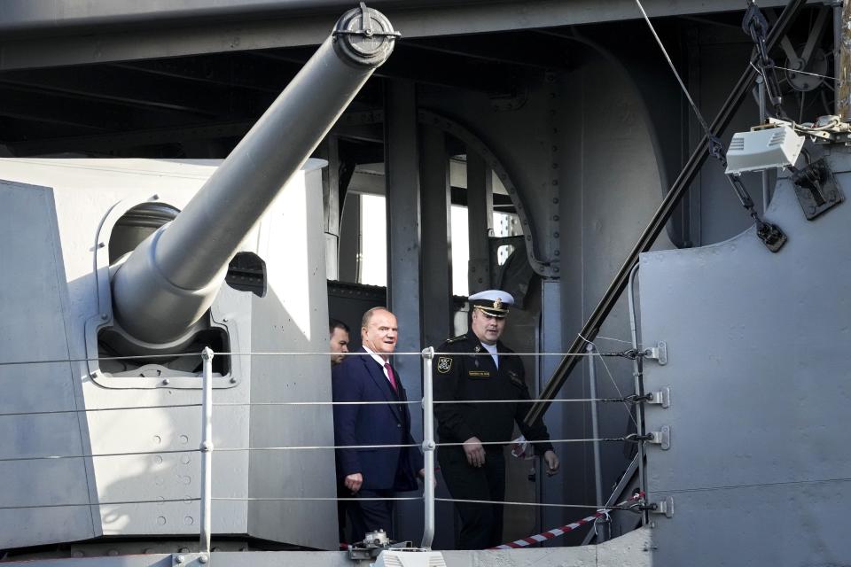 Russian Communist Party leader Gennady Zyuganov, center, visits the historic Aurora cruiser, a symbol of the Bolshevik Revolution of 1917, during a campaign stop in St. Petersburg, Russia, ahead of the election for the State Duma, the lower house of the Russian parliament, on Friday, Sept. 10, 2021. Russia is holding three days of voting that ends on Sunday, Sept. 19, for a new parliament that is unlikely to change the country’s political complexion. The Carnegie Moscow Center's prognosis suggests that most of the seats lost by United Russia would be picked up by the Communist Party, the second-largest parliamentary faction. (AP Photo/Dmitri Lovetsky)