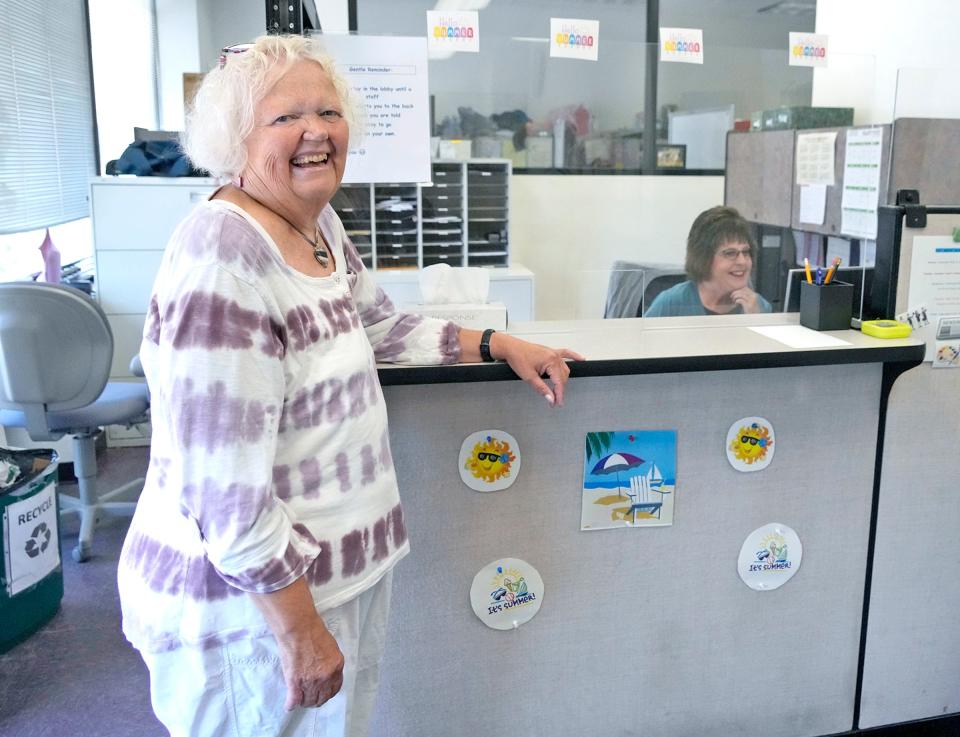 Jana Frey, director of the Program of Assertive Community Treatment stands at a counter with Amy Zimmerman, the operations program assistant, at the clinic on Williamson Street in Madison.