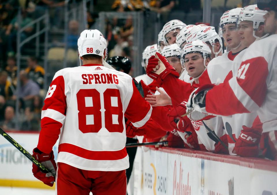 The Detroit Red Wings bench congratulates center Daniel Sprong (88) on his goal against the Pittsburgh Penguins during the second period at PPG Paints Arena in Pittsburgh, on Wednesday, Oct. 4, 2023.