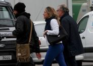 People believed to be family members of those killed in Germanwings plane crash arrive at Barcelona's El Prat airport March 24, 2015. REUTERS/Gustau Nacarino