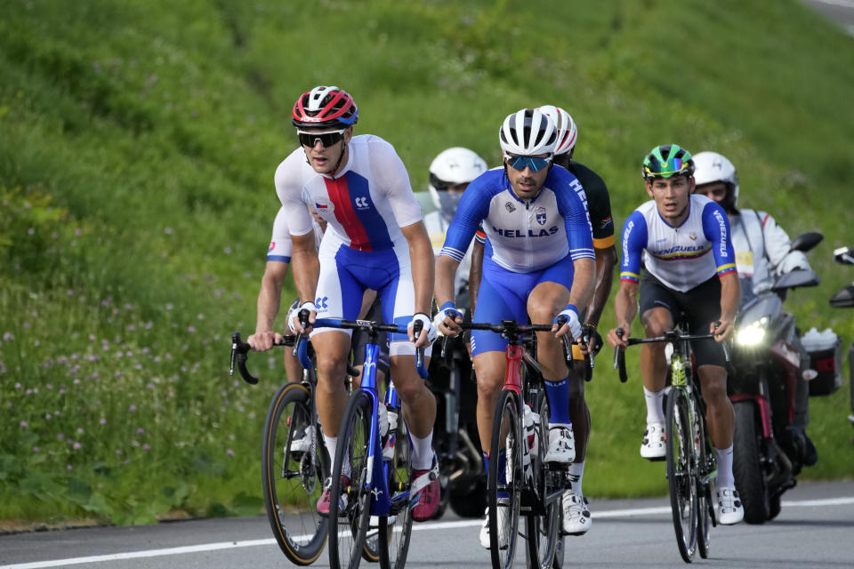 Juraj Sagan of Slovakia, left, competes during the men's cycling road race at the 2020 Summer Olympics, Saturday, July 24, 2021, in Oyama, Japan. (AP Photo/Christophe Ena)