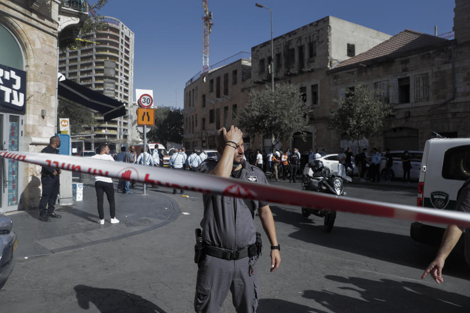 An Israeli Police officer stands guard at the site of stabbing attack in Jerusalem's Central Bus Station Monday, Sept. 13, 2021. Israeli paramedics treated two people who were stabbed near Jerusalem's Central Bus Station by a suspected Palestinian assailant on Monday. (AP Photo/Maya Alleruzzo)