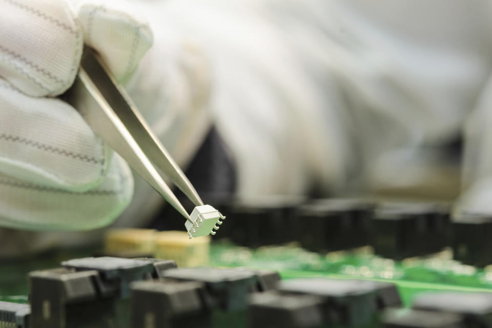 An engineer builds a chip.