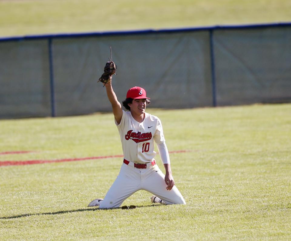 Roy C. Ketcham's Connor Durkin makes a diving catch for a fly ball hit by Arlington's Christian Adorno during Wednesday's game on May 17, 2023. 